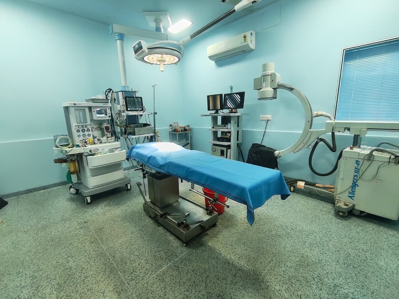 Operating theatre with C-arm and anaesthesia equipment at BBSM Nursing Home, Raebareli